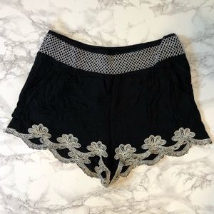 Flowy black shorts with white/cream stitching